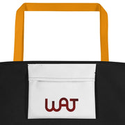 Inside view of the black My Commitment Different WAJ Large Tote Bag with yellow handle.