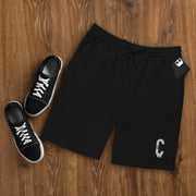 Front view of Black Clout Fleece Shorts with drawstring and white Clout design.