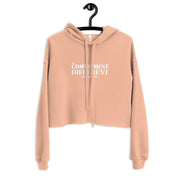 Front view of peach colored My Commitment Different Crop Hoodie.