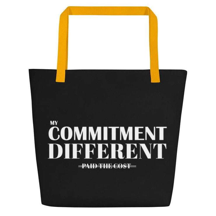 Front view of the black My Commitment Different WAJ Large Tote Bag with yellow handle.