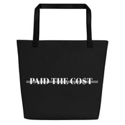Front view of the black Paid The Cost Large Tote Bag.