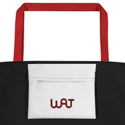 Inside view of the black Paid The Cost Large Tote Bag with red handle.