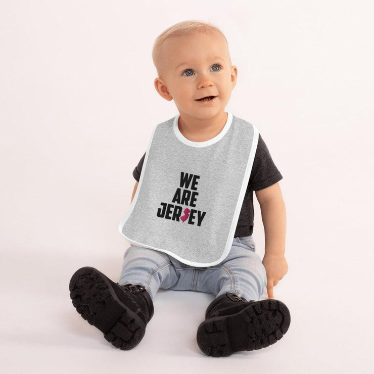 We Are Jersey Baby Bib mock up with a white outline.