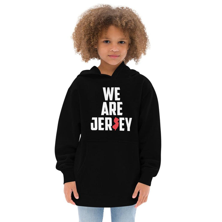 Female child showing off her jersey pride with the black We Are Jersey Kids Hoodie