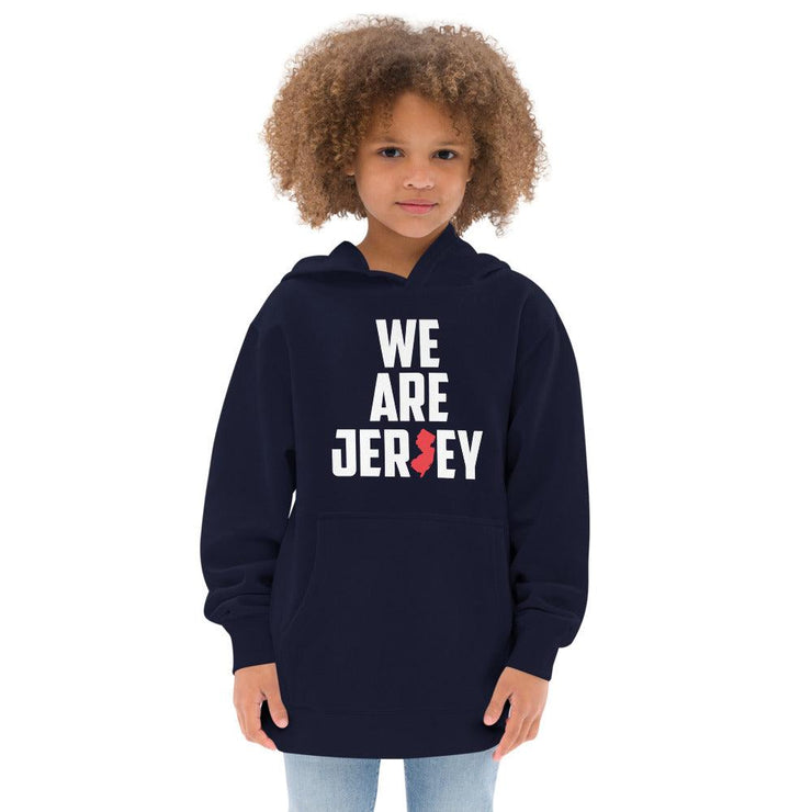 Female child wearing the navy blue We Are Jersey Kids Hoodie. 